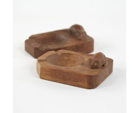 A pair of Robert "Mouseman" Thompson oak ashtrays,mid 20th century, length 10cmGood overall condition.  Burn mark to one asht