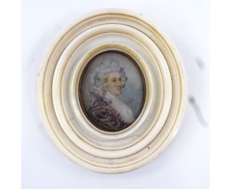 A Georgian miniature watercolour on ivory, portrait of a lady with powdered hair, unsigned in moulded oval ivory frame, overa