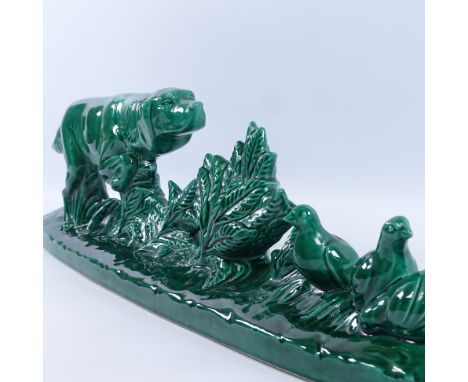 A French green glaze ceramic sculpture of a Pointer dog stalking grouse, circa 1950s, signed B Rezl (899 - 1963), length 63cm