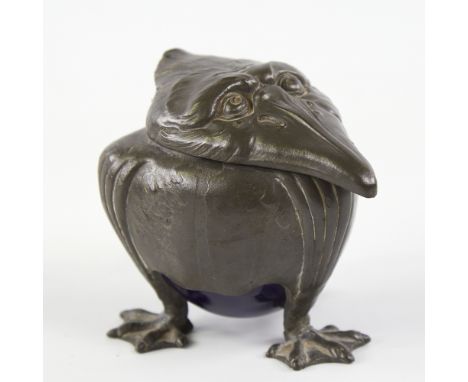 Attributed to Kayserzinn Jugendstil, a pewter inkwell, late 19th / early 20th century, grotesque bird form with blue glazed c