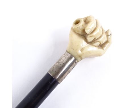 A 19th century ebony walking cane, with marine ivory clenched fist knop and silver collar, by Briggs of London, length 96cm. 