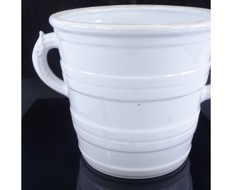 A 19th century white glaze ceramic 2-handled milk pail with raised bands, diameter excluding handles 27cm, height 24cmGood or