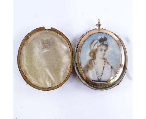 A Georgian miniature watercolour on ivory, half-length portrait of a young lady with a ribbon in her hair, unsigned, in origi