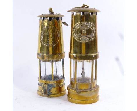 Two brass miners lamps, made by E Thomas & Williams, Aberdare, Wales and The Protector Lamp & Lighting Co, Eccles, largest he