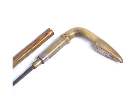 A late Victorian carved horn-handled swordstick with silver plaque inscribed S A Thompson 1899Stick is missing its end cap, g