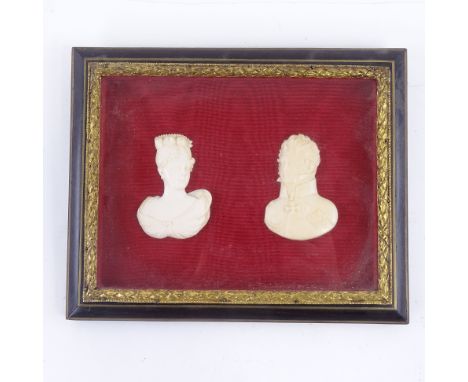 ROYAL INTEREST - a pair of 19th century relief carved ivory portrait busts of Princess Charlotte and Leopold, mounted on red 