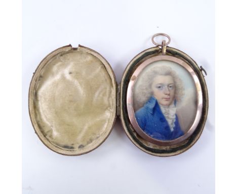 A Georgian miniature watercolour on ivory, portrait of a gentleman wearing a blue coat with frilled stock, unsigned, unmarked