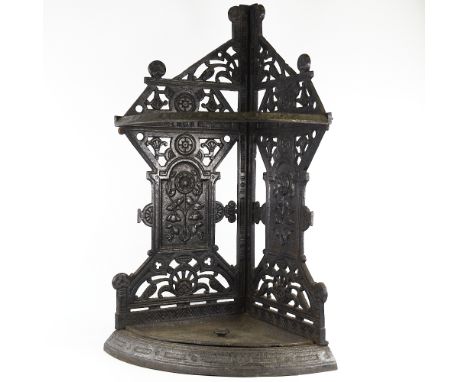 A Victorian Aesthetic Movement cast-iron corner stick stand in the manner of Christopher Dresser, with relief moulded decorat