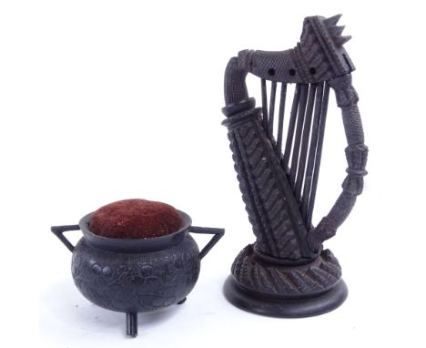 A Victorian Irish bog oak harp, and a pin cushion cauldron, harp height 14cm.Cauldron is in good used condition, shamrock dec