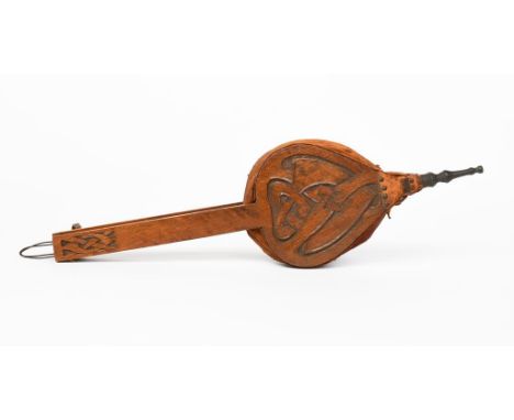 A pair of Liberty &amp; Co Otley oak fire bellow designed by Archibald Knox, carved with Celtic knot panels to one side, unsi