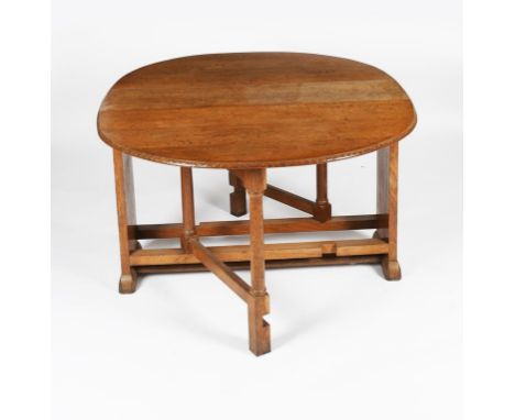 A Heal's oak gate-leg table designed by Ambrose Heal, made as a wedding present for his son Anthony in 1941, the hinged top w