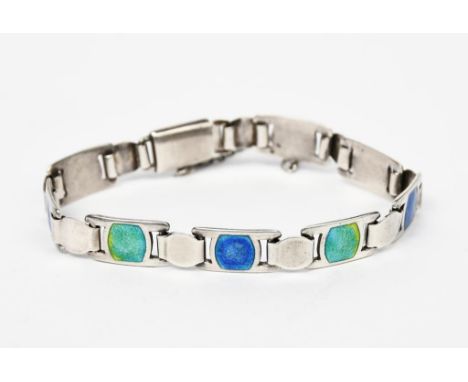 A James Fenton silver and enamel bracelet, silver panel link form with blue enamel panels, stamped marks, Birmingham 1908, 17