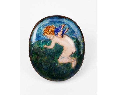 A small enamel panel, oval, painted with a cherub in a landscape, in colours, unsigned, 5.5cm. long