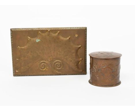 A Newlyn patinated copper tea caddy and cover, cylindrical form, hammered in relief with a frieze of scaly fish and waterweed