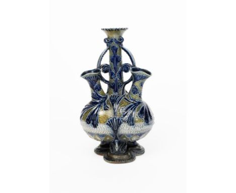 An early Martin Brothers stoneware vase by Robert Wallace Martin, dated 1876, tri-lobed body on foliate tripod base, supporti