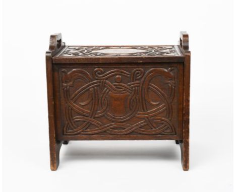 An oak coffer or shoe box the design attributed to Alexander Ritchie of Iona, tapering rectangular form, carved with panels o
