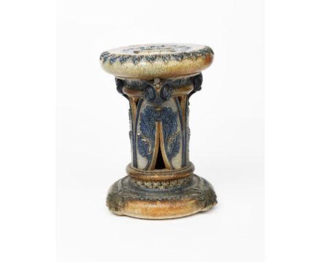 A Martin Brothers salt-glaze stoneware garden seat by Robert Wallace Martin, the foot and body cast in relief with foliate ba