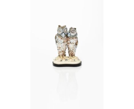 A rare Martin Brothers stoneware Owl double bird jar and covers by Robert Wallace Martin, dated 1902, the larger bird modelle