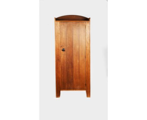 A Heal's oak John Dawson single wardrobe designed by Ambrose Heal, designed 1919, hinged panel door with ebonised wood handle