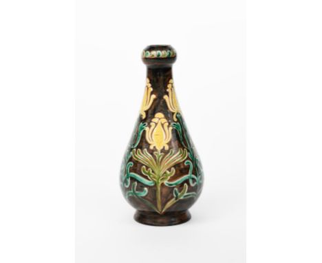 A Della Robbia Pottery vase by Hannah Jones, footed, tapering form with swollen knopped neck, painted with Art Nouveau tulip 