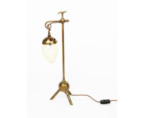 A brass table lamp in the manner of Benham &amp; Froud, tripod foot supporting ball, cylindrical stem with scroll terminal su