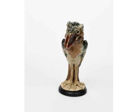 A large and impressive Martin Brothers stoneware bird jar and cover by Robert Wallace Martin,  the tall slender bird with lon