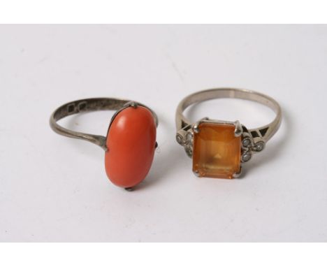 A white gold ring stampt 18ct and set with an amber stone and one other vintage ring set with coral (2)