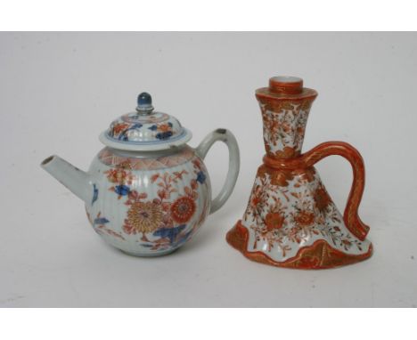 An 18th Century Chinese teapot and a Kutani candlestick.