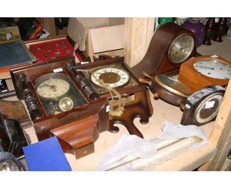 A collection of various mantle and wall clocks and a barometer