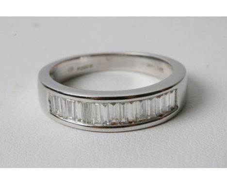 A modern design 18ct white gold ring inset with baguette diamonds 1ct approx