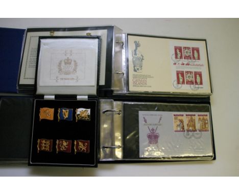 A cased limited edition set of 1977 Silver Jubilee commemorative flag medallions, two sets of conforming First Day covers and