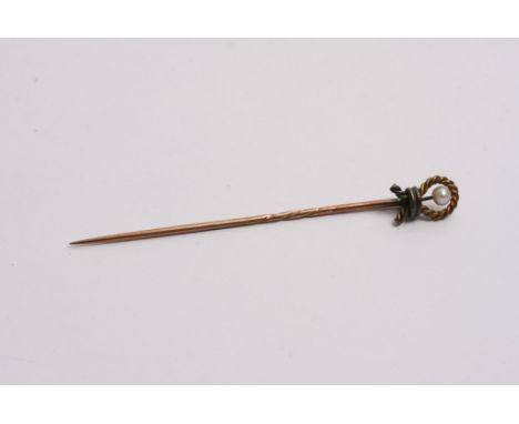  A 9ct gold stick pin inset with a single pearl 