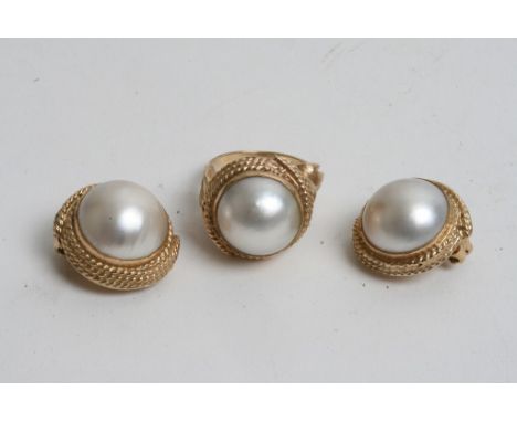 A 14ct gold ladies pearl ring and a pair of 14ct gold pearl clip on earrings. 