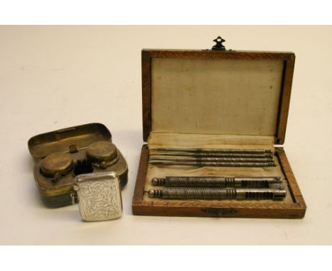 A silver vesta case, Birmingham 1910, a mixed metal travelling inkwell and a cased nutcracker and pick set.