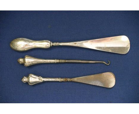 Silver button hook and two silver shoe horns