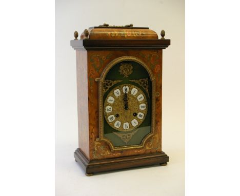 A modern marquetry mantel clock, the ornate gilt dial with Roman numerals 