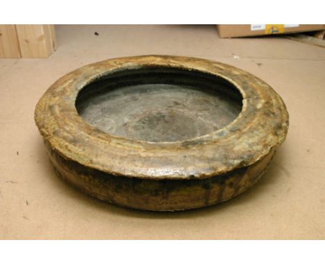 An unusual contemporary ceramic stoneware dish of circular shape 