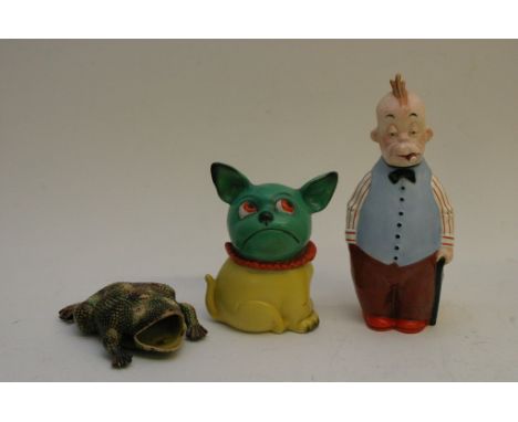 A ceramic spirit bottle formed as a comical figure, a 1930's tobacco jar and majolica type  toad wall pocket