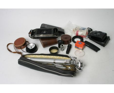 A collection of photographic equipment to include a Kodak No 1a folding camera, light meter etc