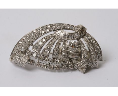  An Art Deco platinum and diamond brooch inset with a central pearl 