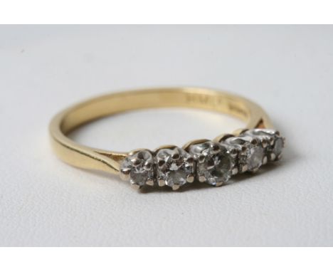  An 18ct gold five stone diamond ring 