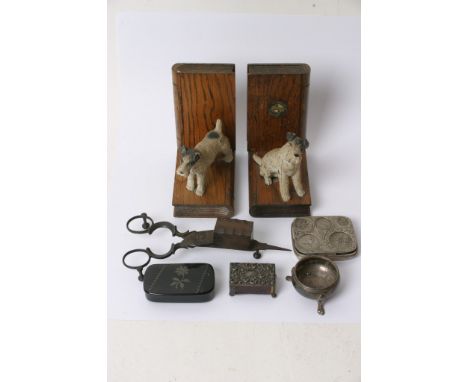 A collection of oddments comprising silver salt, snuff box, match box holder, candle snuffers and a pair of painted metal dog