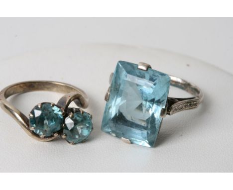 A 9ct gold ring inset with two aquamarine type stones and one other conforming ring (2) 