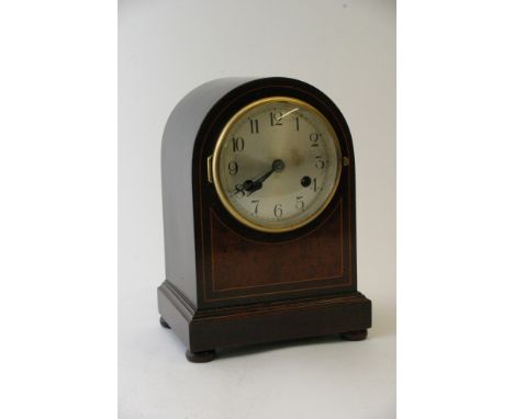A mahogany mantel clock, the silvered dial with Arabic numerals, inlaid with burr maple 