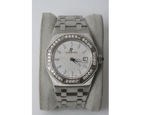 A fine Quality ladies Audemars Piguet Stainless steel watch with a diamond bezel in working order and original box 