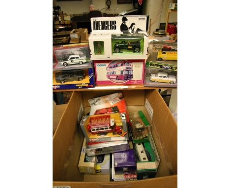 A box containing a collection of boxed Corgi model vehicles including coaches, a Guiness lorry, Buster, The Avengers etc 