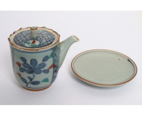 A signed Chinese teapot together with a saucer 