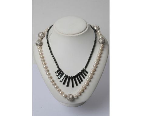 A good size culture pearl necklace and a modern design necklace 
