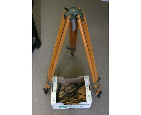 An old wooden tripod and collection of sandcasting tools