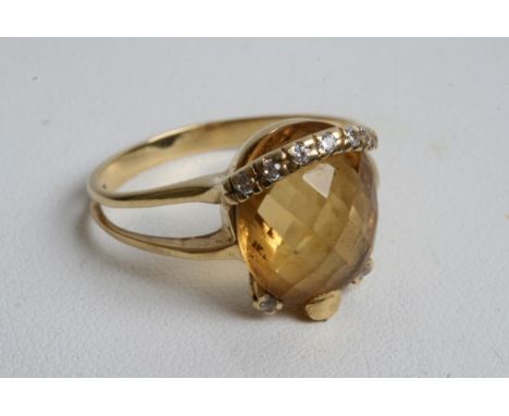 An 18ct gold diamond and citrine ring 